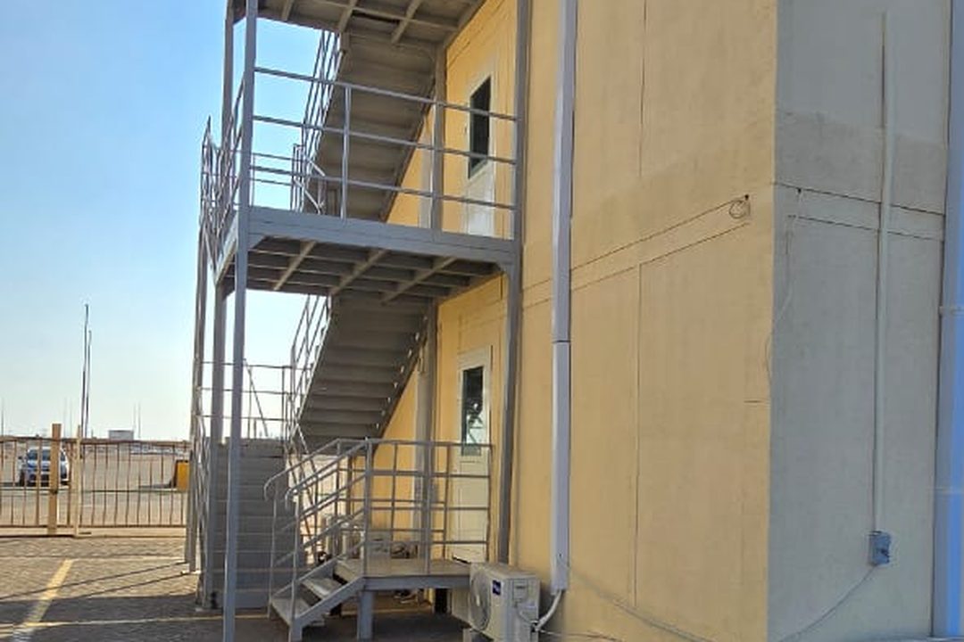 Escape stair and condenser bank at the gable