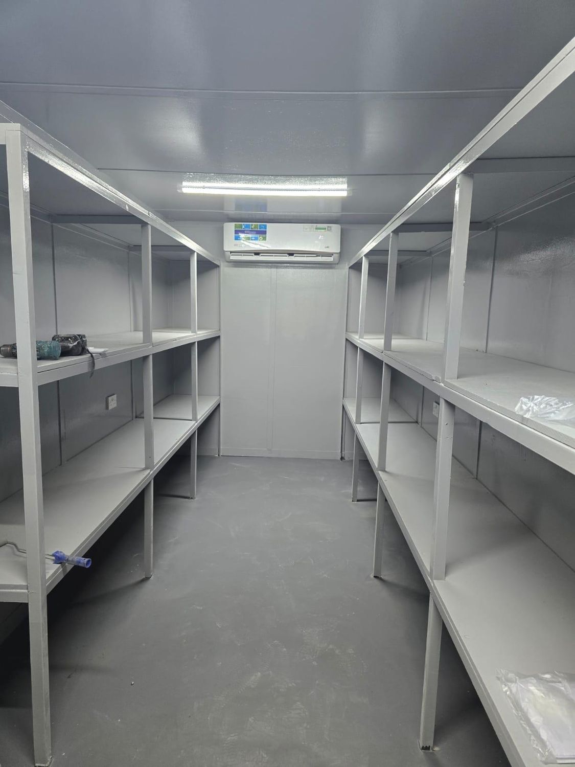 Insulated and shelved storage container interior